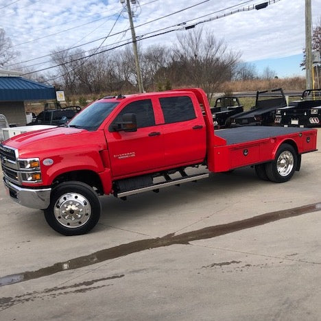 Bright Red Chevy 4500 empty truck bed riding on 22.5x7.5 Alcoa High Polished Both Sides